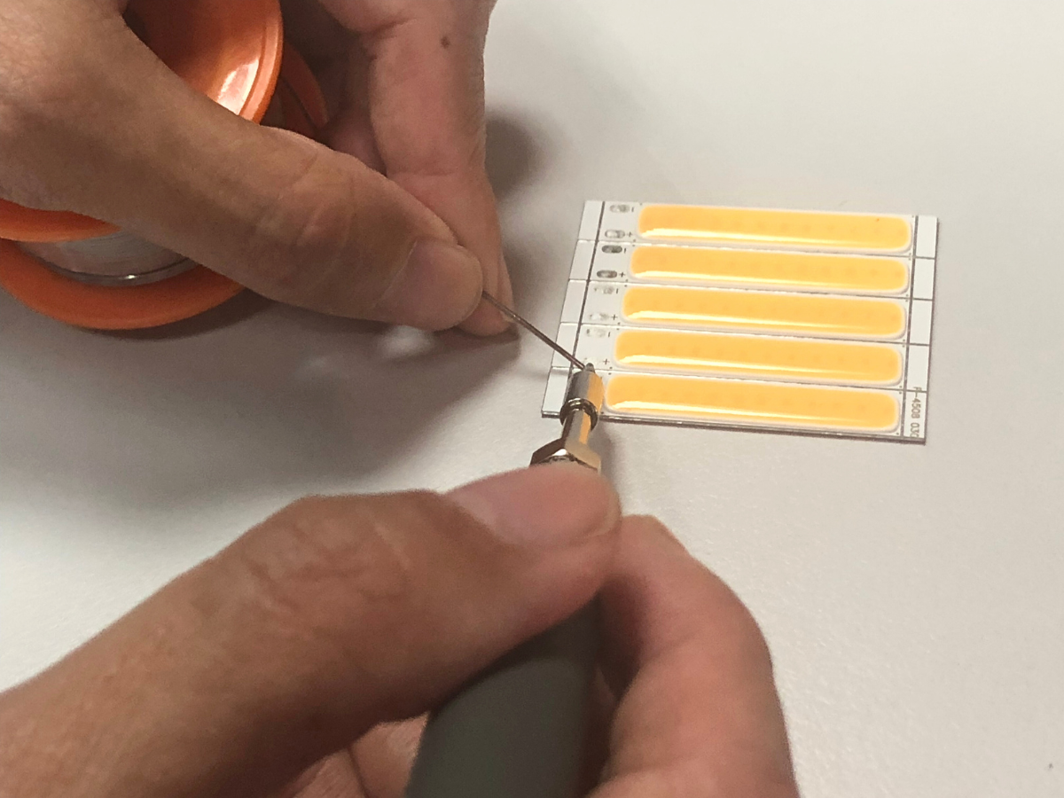Founder of Ascend Makea soldering LED components during hands-on electronics prototyping session